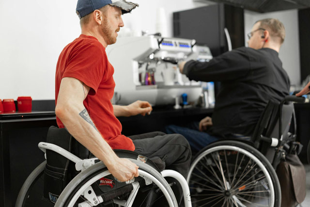 Two gentlemen in wheelchairs enjoying their stay in Montauk, NY.