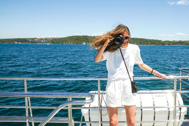 Woman preparing to take great photos of whales.